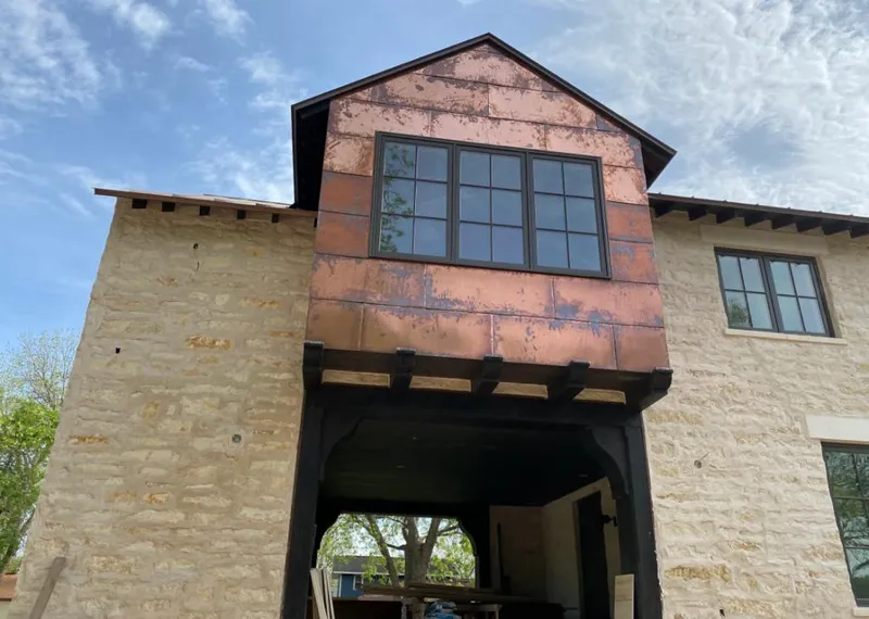 Copper metal panel facade on a stone building for Skylight Installation in Calipatria