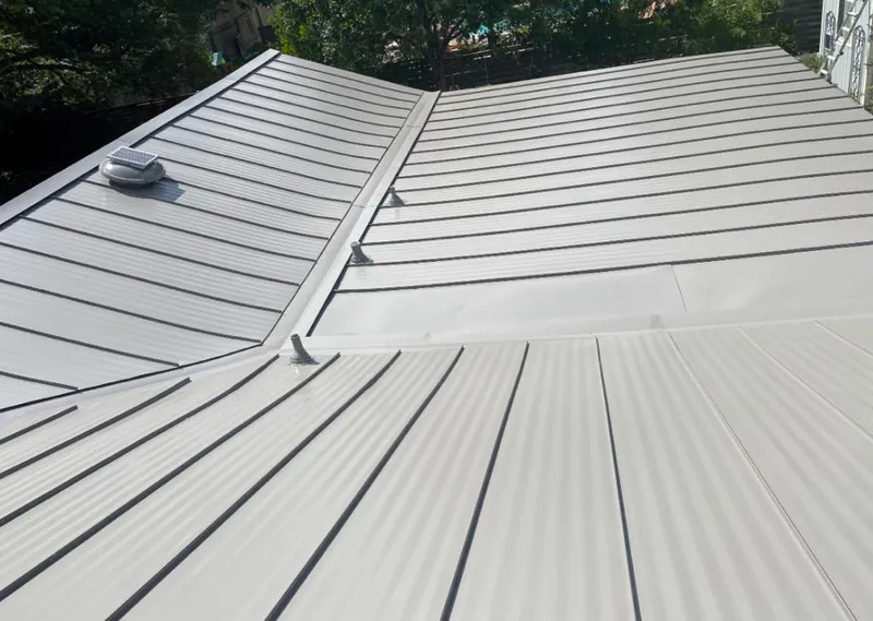 Solar attic fan installed on a metal roof for Roof Ventilation in Calipatria